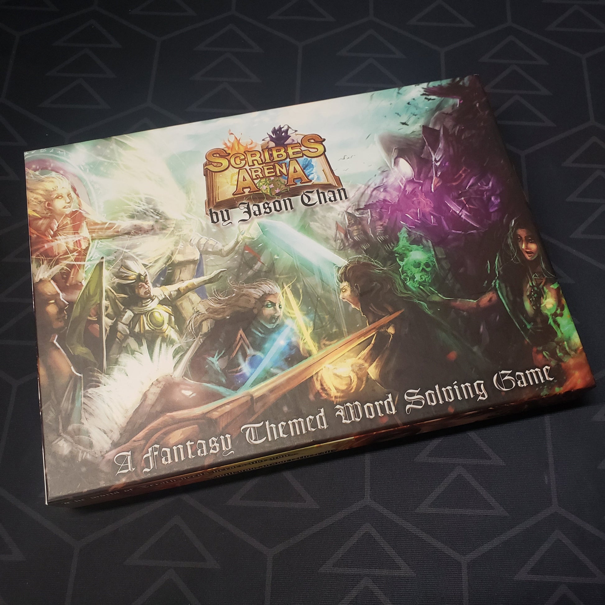 Image shows the front cover of the box for the Scribe's Arena card game