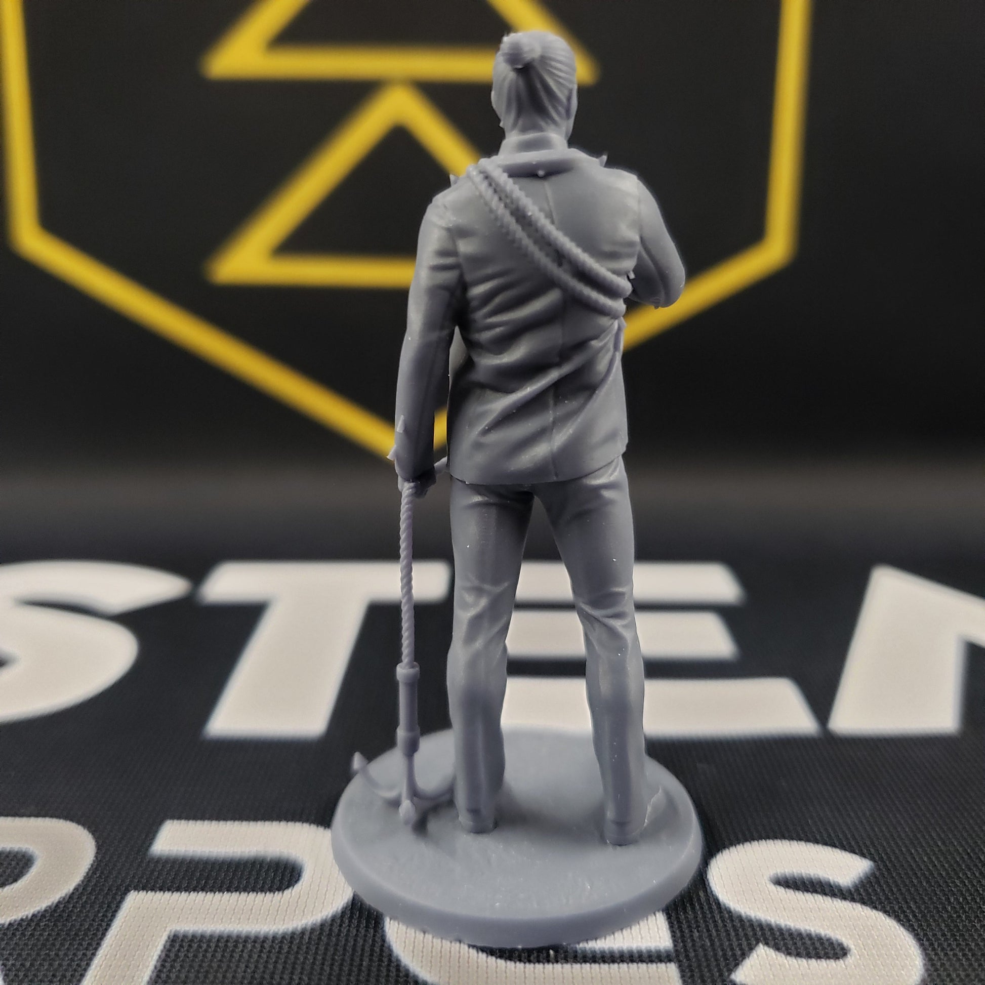 Image shows the back of a security consultant 3D printed gaming miniature.