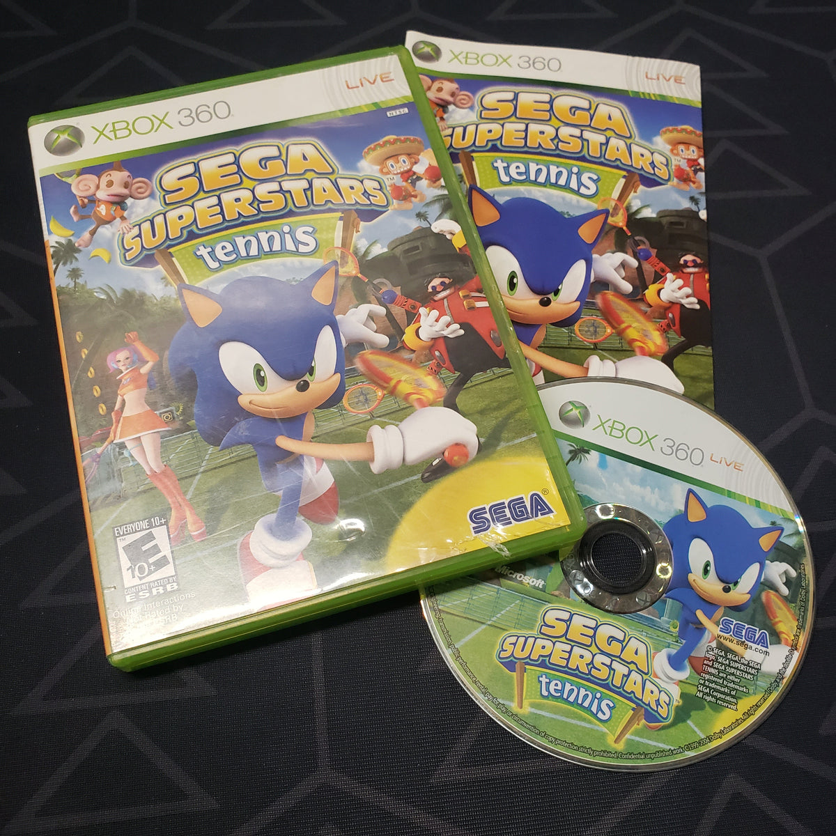 Image shows the case, manual and disc for the video game Sega Superstars Tennis for Xbox 360