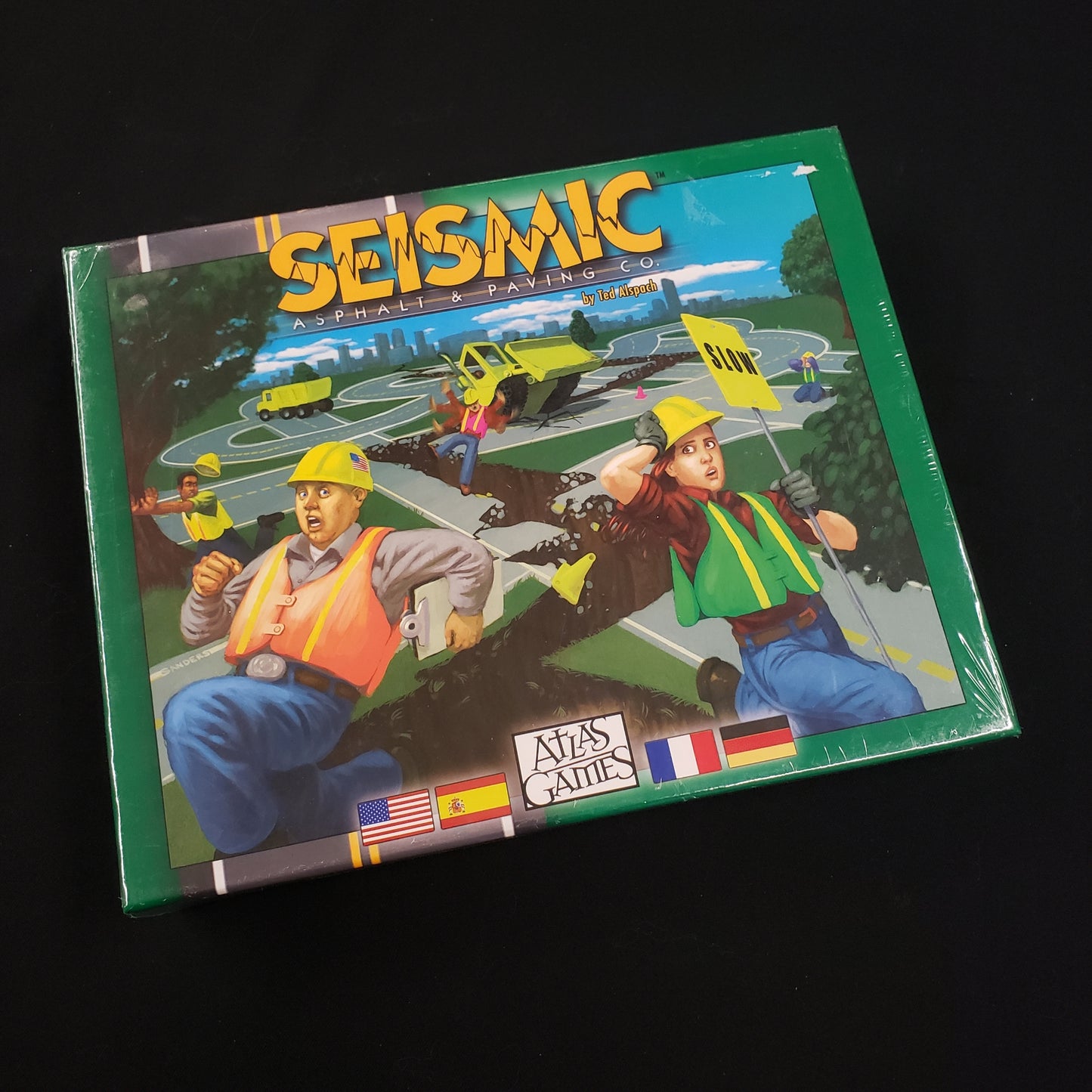 Image shows the front cover of the box of the Seismic board game