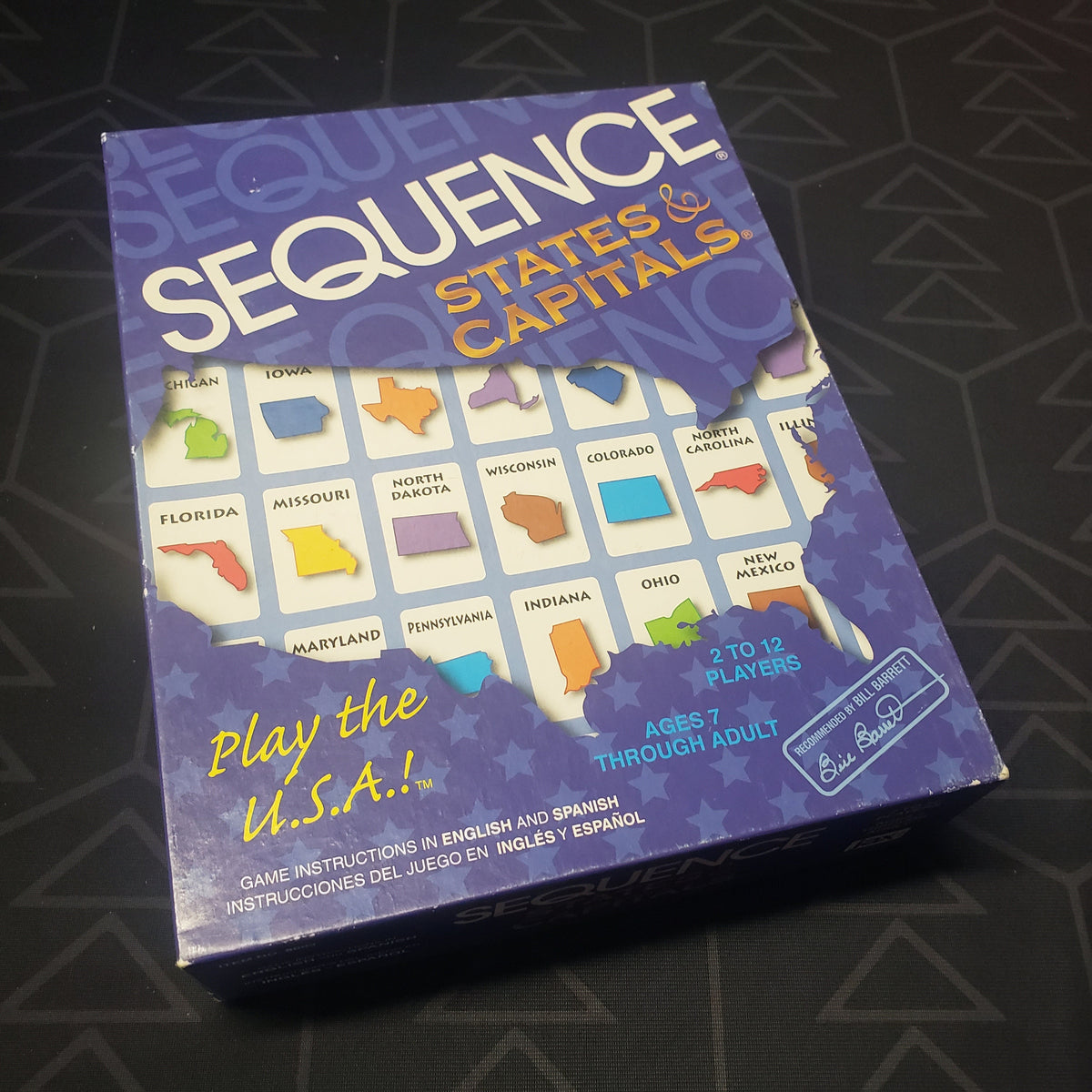 Image shows the front cover of the box for the Sequence: States & Capitals board game
