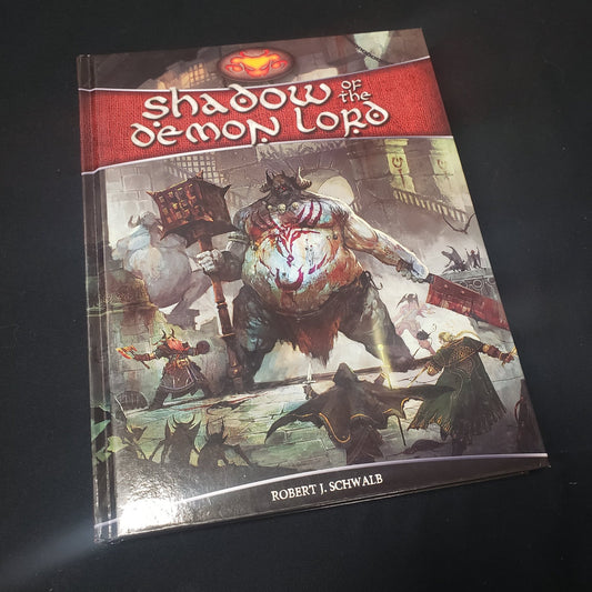 Image shows the front cover of the core rulebook for the roleplaying game Shadow of the Demon Lord