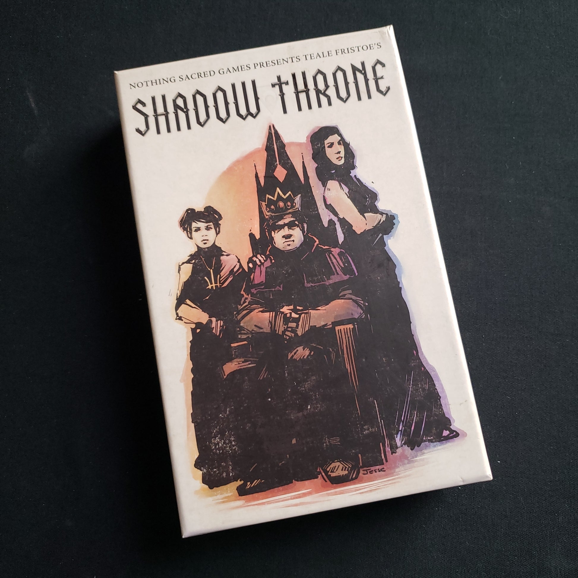 Image shows the front cover of the box of the Shadow Throne card game