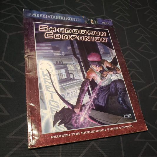 Image shows the front cover of the Shadowrun Companion book for the roleplaying game Shadowrun 3E
