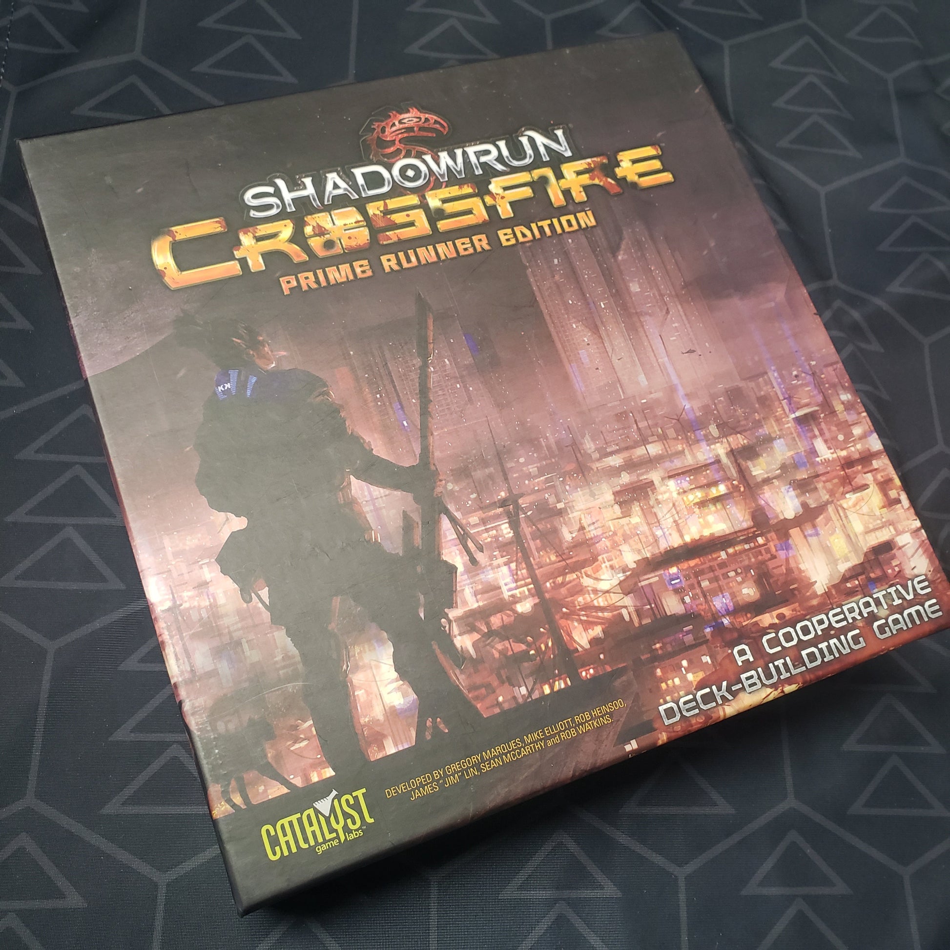 Image shows the front cover of the box for the Shadowrun Crossfire: Prime Runner Edition card game