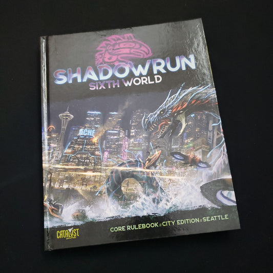 Image shows the front cover of the Seattle City Edition of the core rulebook for the roleplaying game Shadowrun: Sixth World