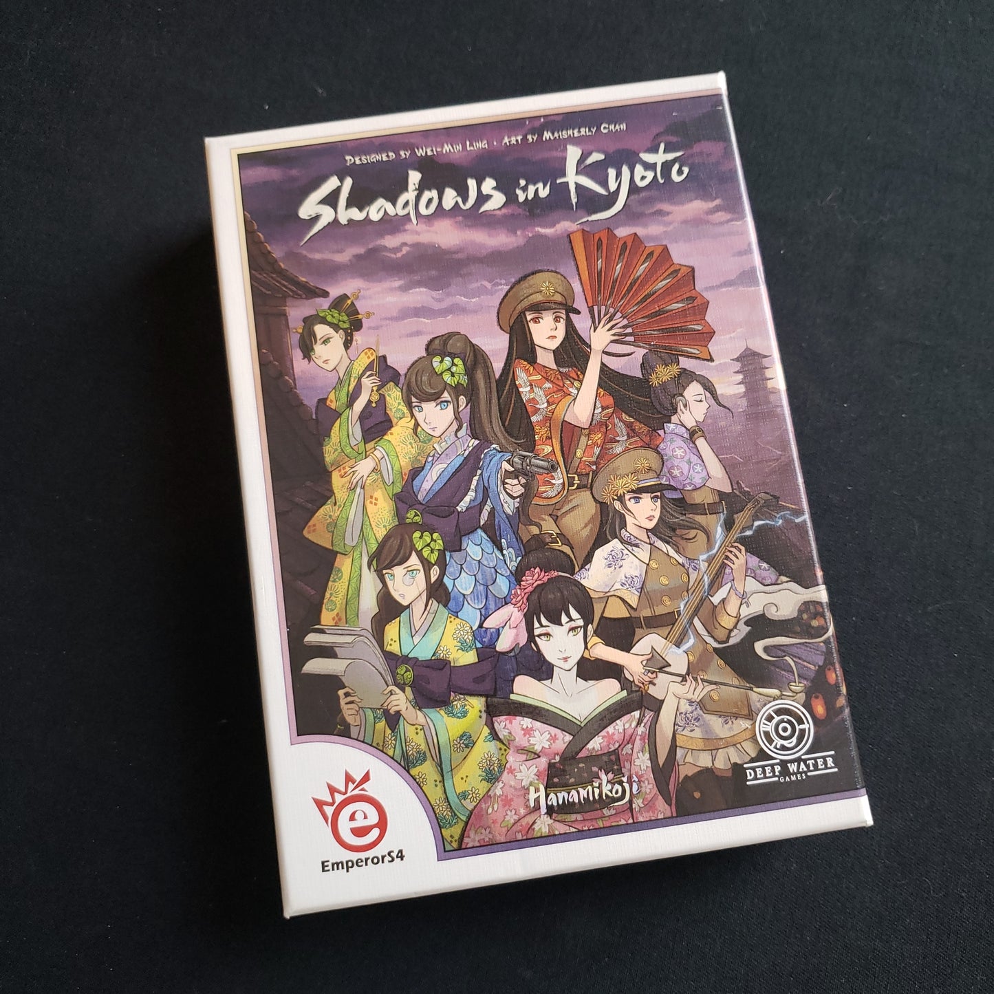 Image shows the front cover of the box of the Shadows in Kyoto board game