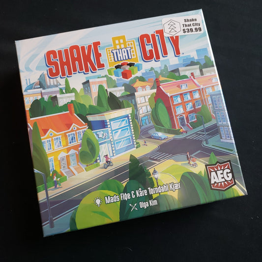 Image shows the front cover of the box of the Shake That City board game