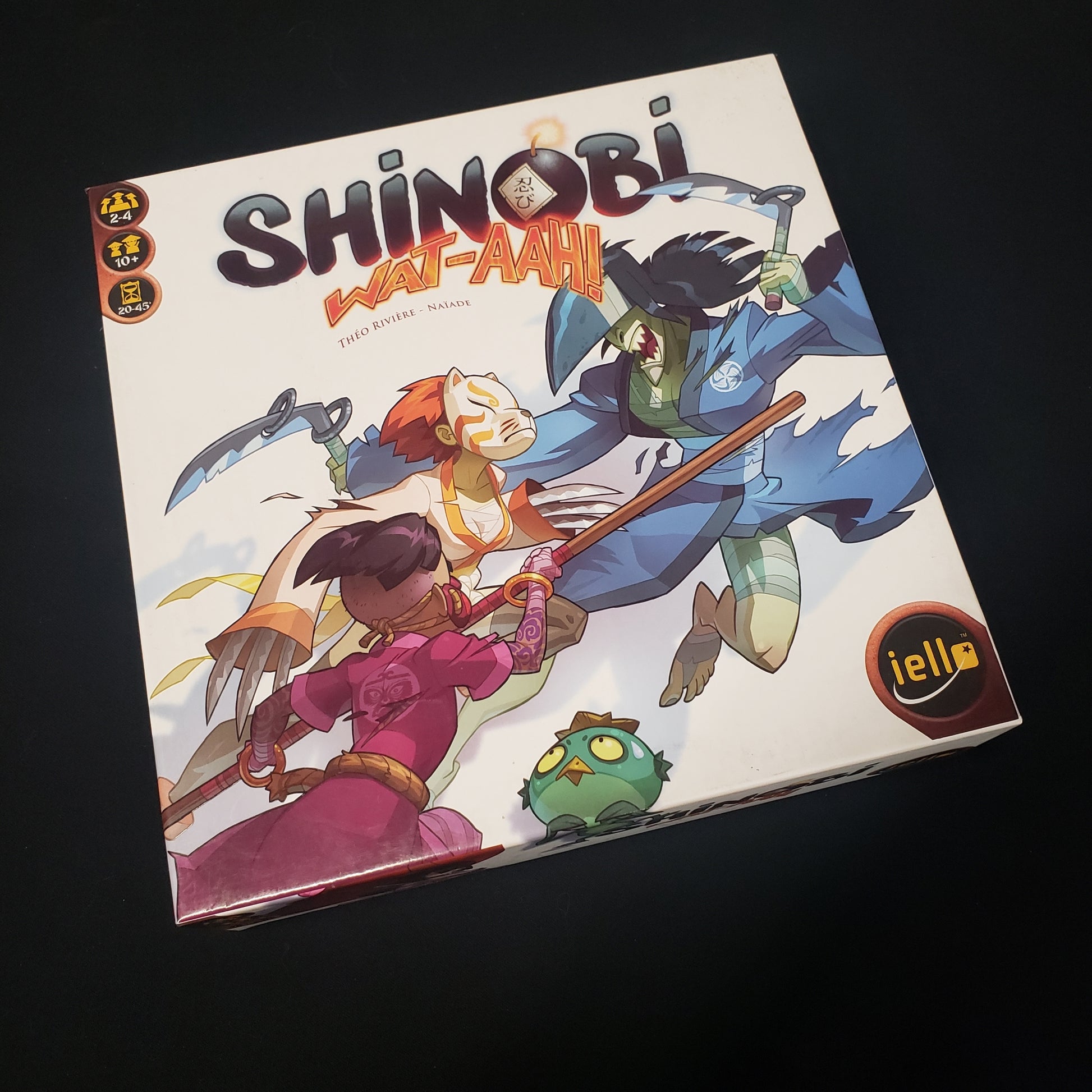 Image shows the front cover of the box of the Shinobi Wat-Aah board game