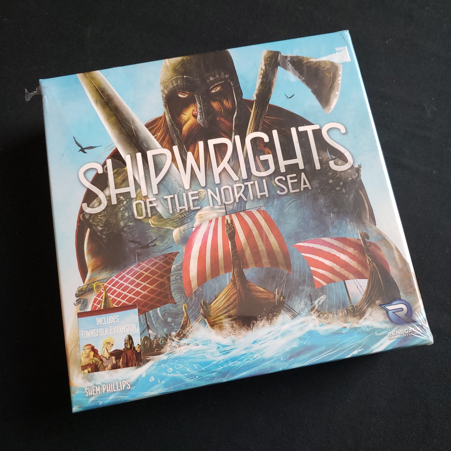 Image shows the front cover of the box of the Shipwrights of the North Sea board game