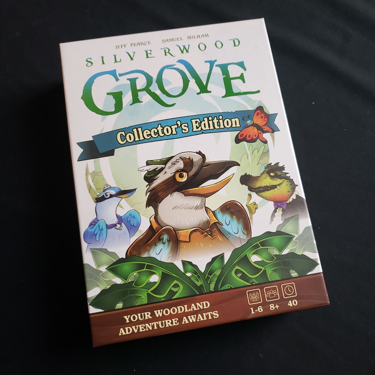 Image shows the front cover of the box of the Silverwood Grove: Collector's Edition board game