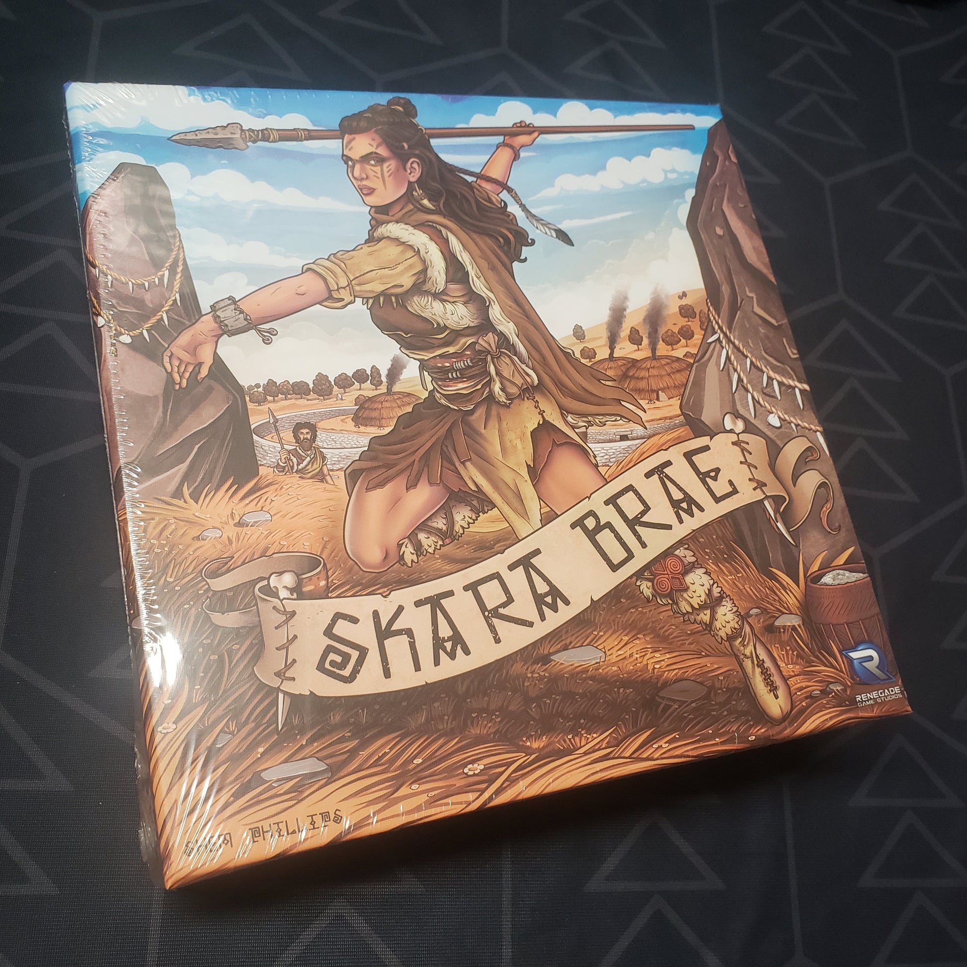 Image shows the front cover of the box for the Skara Brae board game