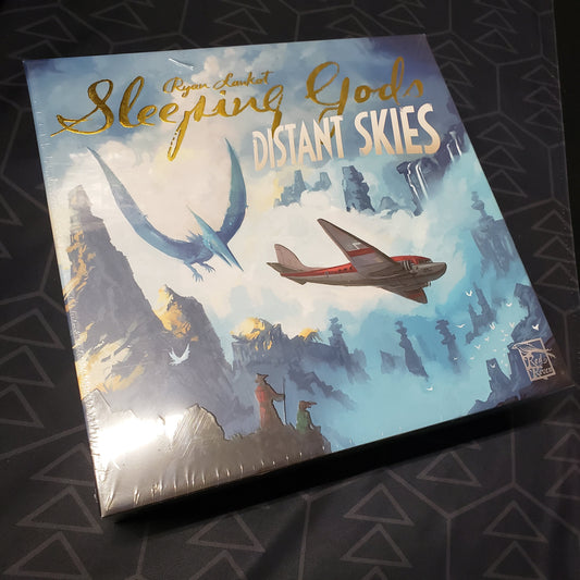 Image shows the front cover of the box for the Gamefound Edition of the board game Sleeping Gods: Distant Skies