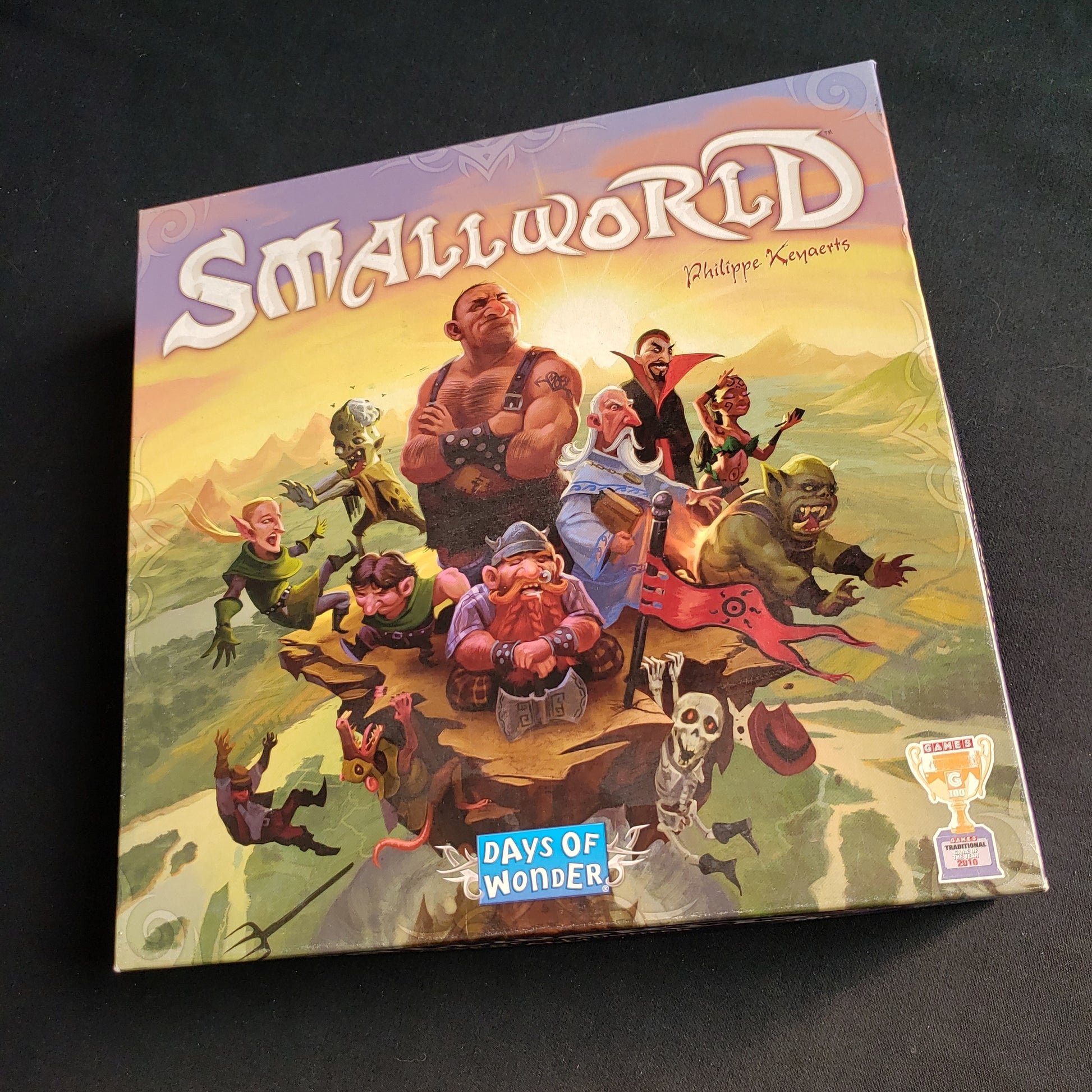 Image shows the front cover of the box of the Small World board game