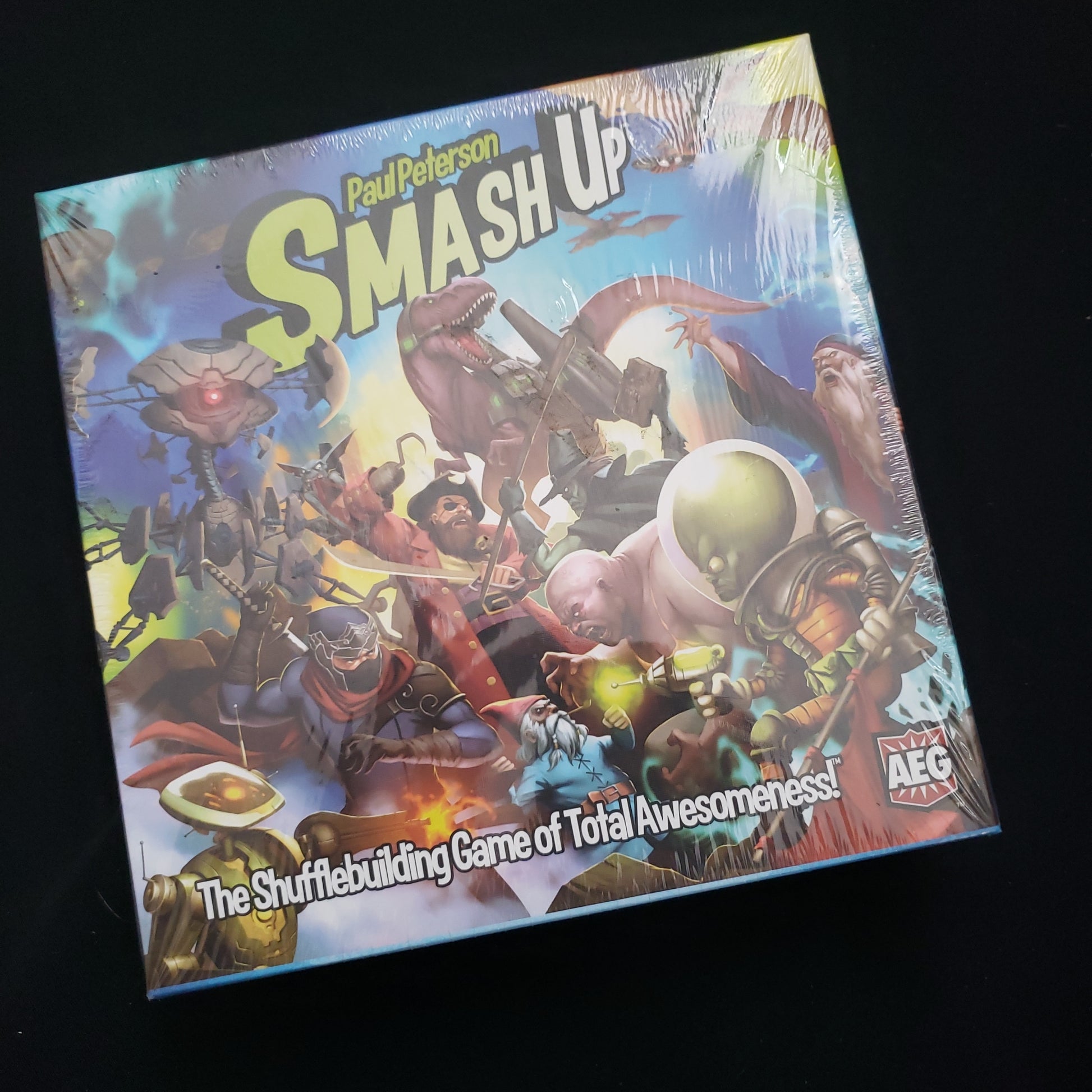 Image shows the front cover of the box of the Smash Up card game