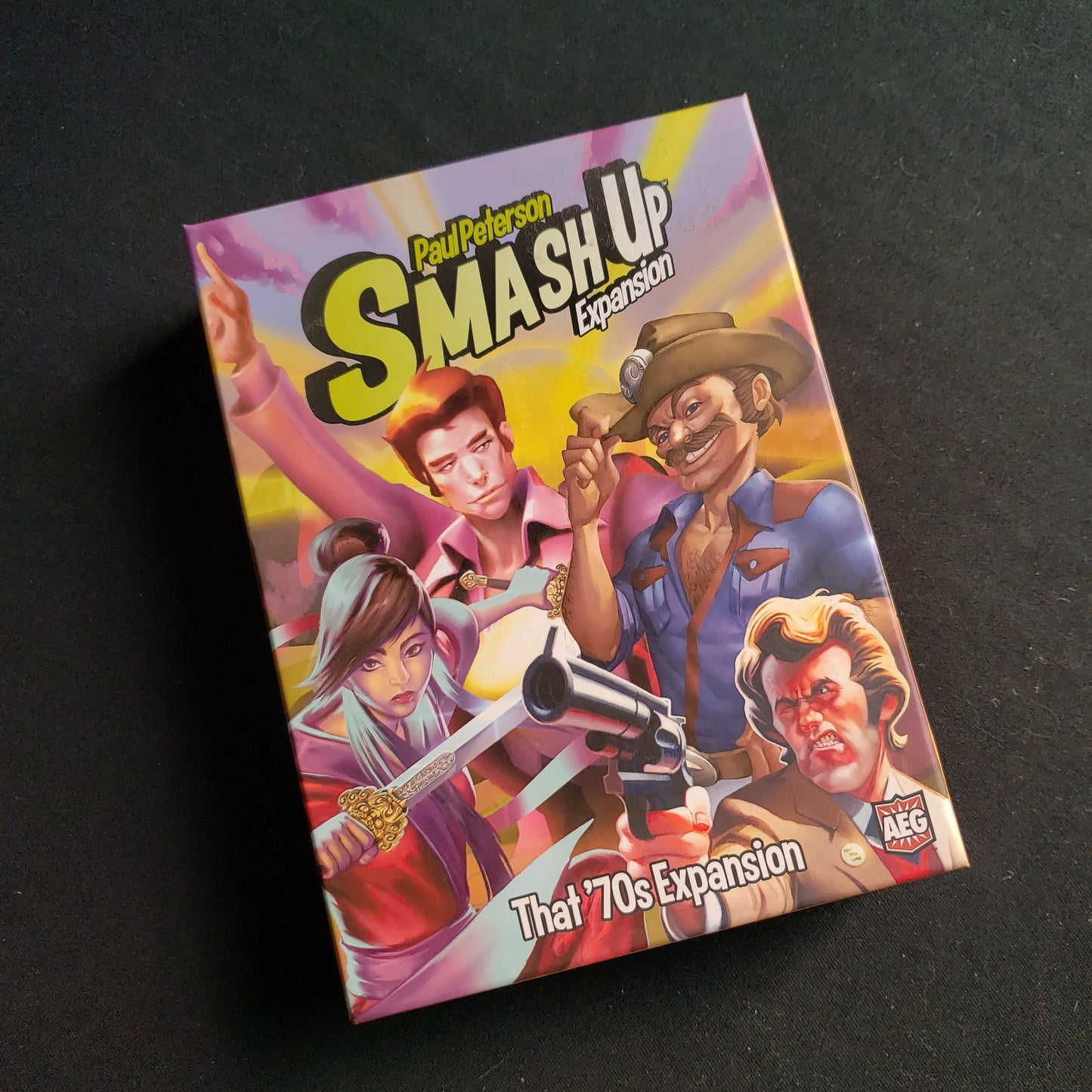 Image shows the front of the box for the That '70s Expansion for the Smash Up card game