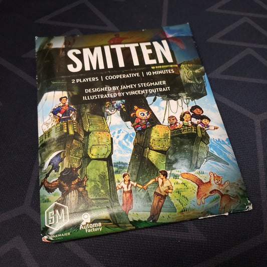 Image shows the front of the packaging for the Smitten card game