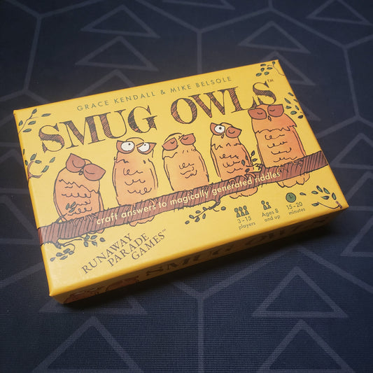 Image shows the front cover of the box for the Smug Owls card game