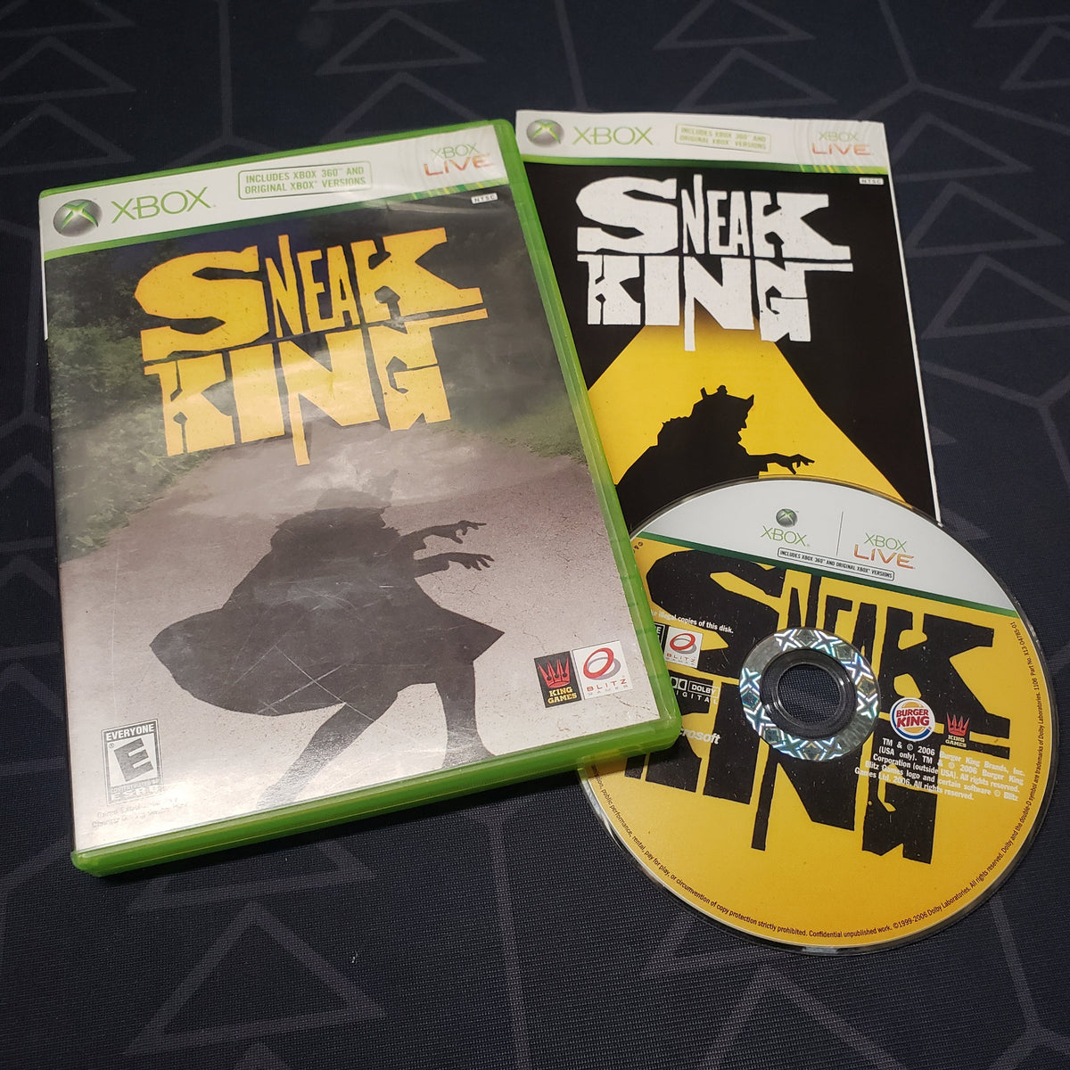 Image shows the case, manual and disc for the video game Sneak King for Xbox 360