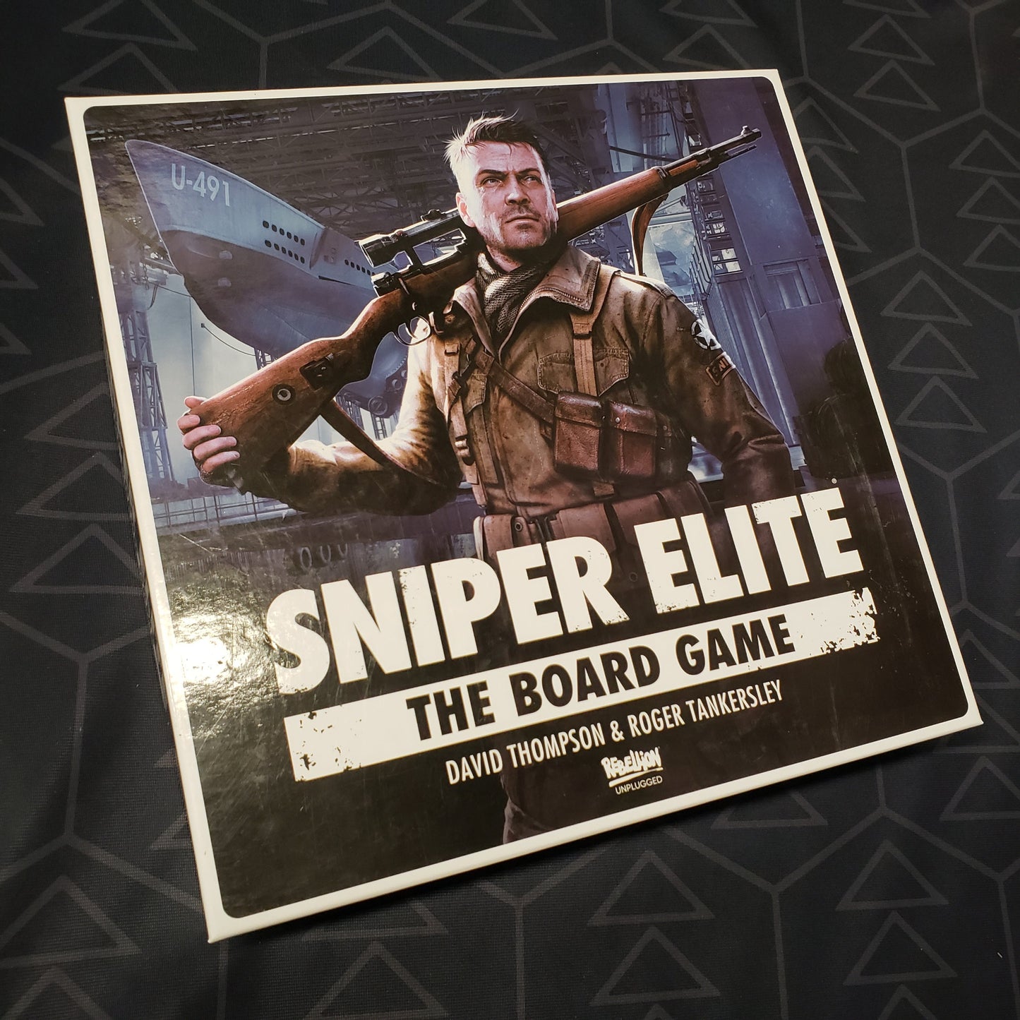 Image shows the front cover of the box for Sniper Elite: The Board Game
