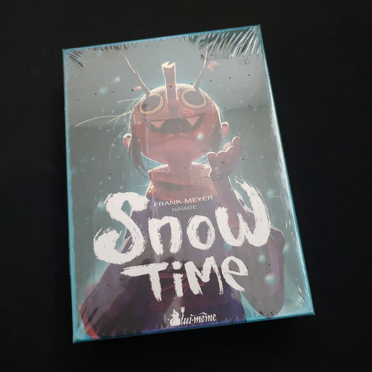 Image shows the front cover of the box of the Snow Time card game