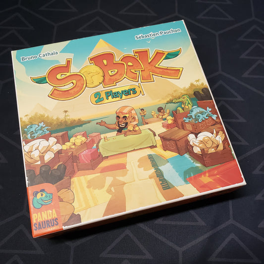Image shows the front cover of the box for the Sobek: 2 Players board game