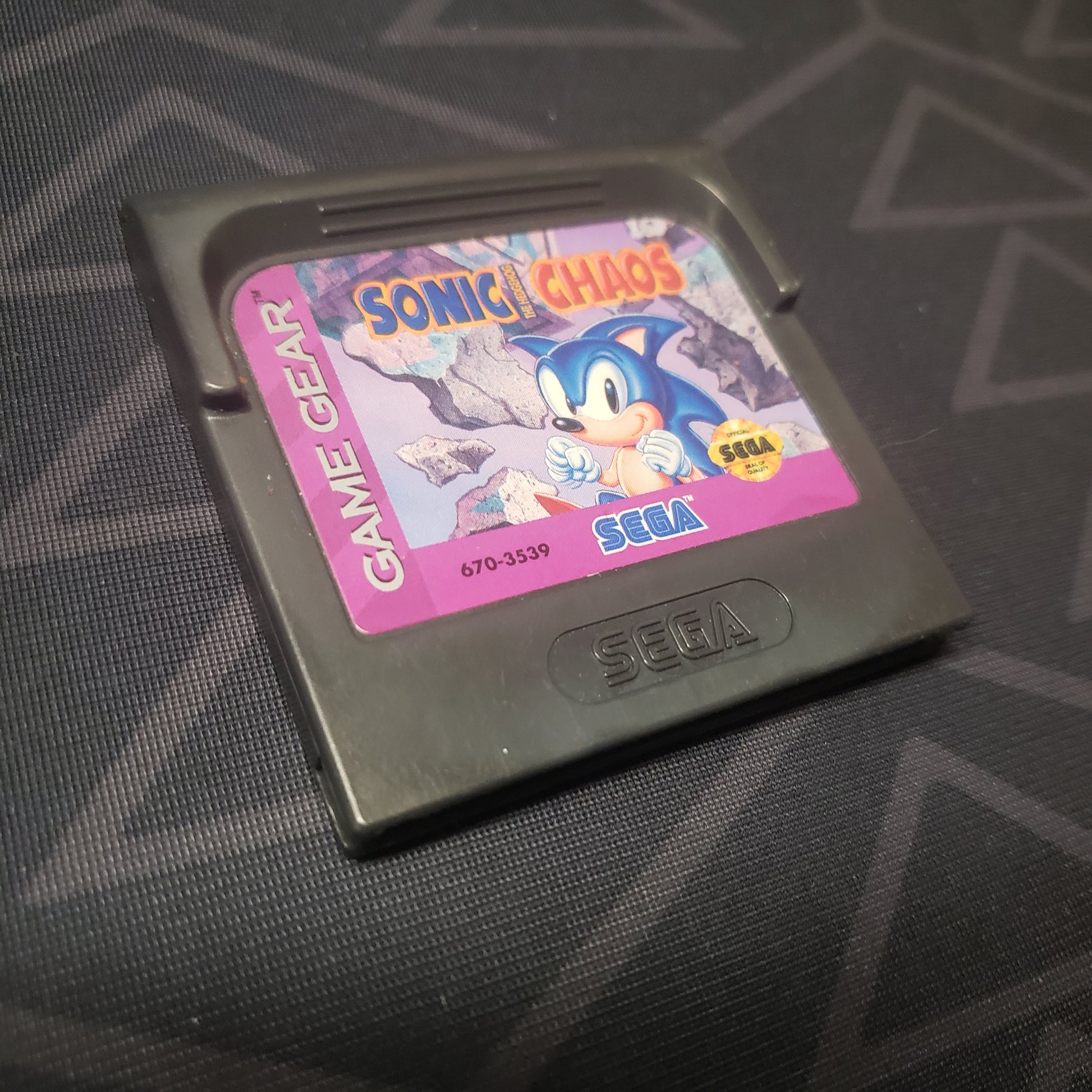 Image shows the front of the cartridge for the video game Sonic Chaos for the Sega Game Gear