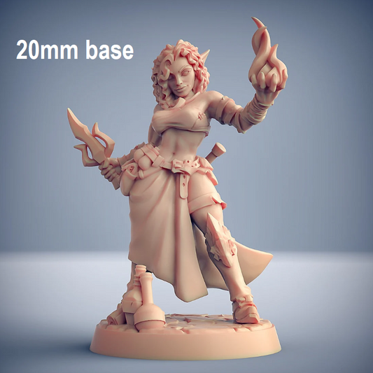 Image shows an 3D render of a elf sorceress gaming miniature holding a dagger & a fireball