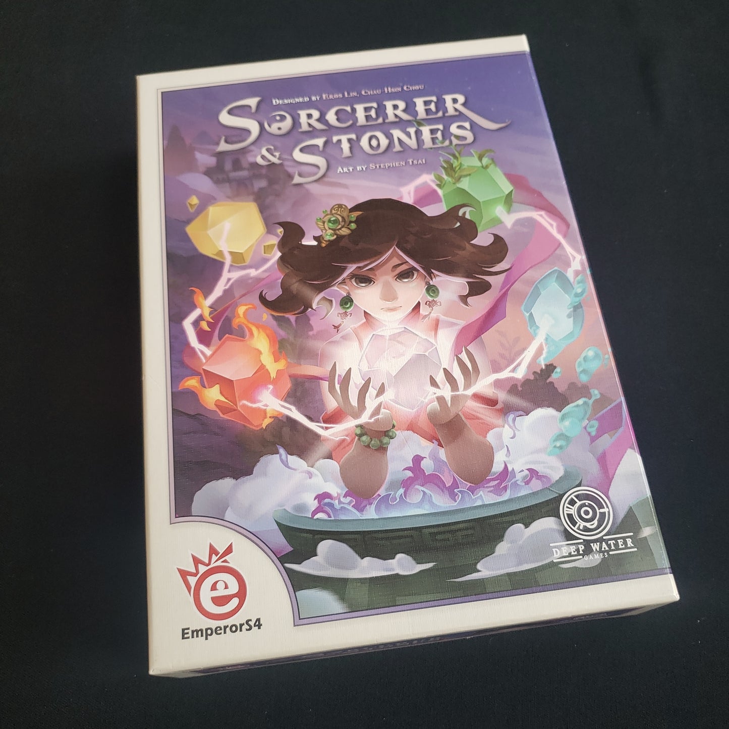 Image shows the front cover of the box of the Sorcerer & Stones board game