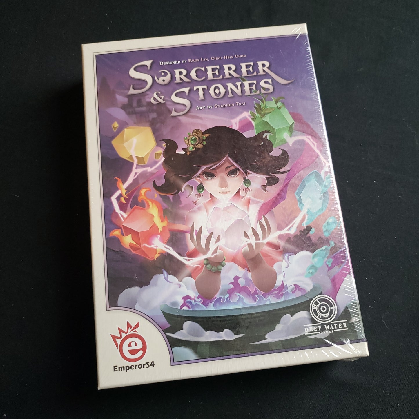 Image shows the front cover of the box of the Sorcerer & Stones board game