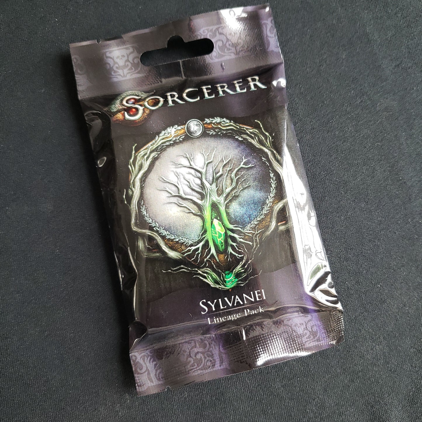 Image shows the front of the package for the Sylvanei Lineage Pack for the card game Sorcerer