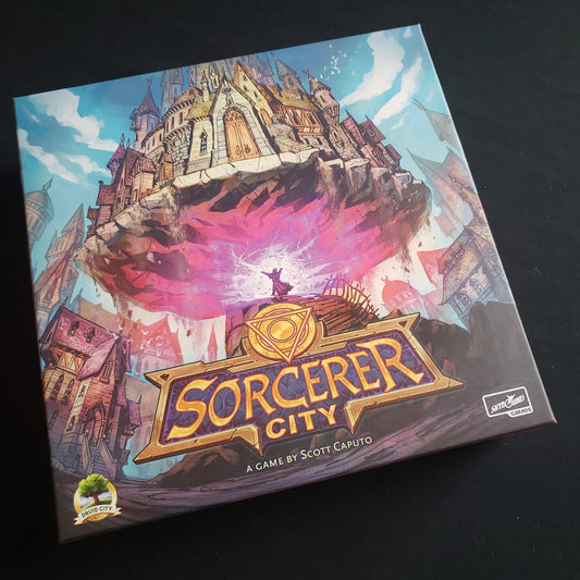 Image shows the front cover of the box of the Sorcerer City board game