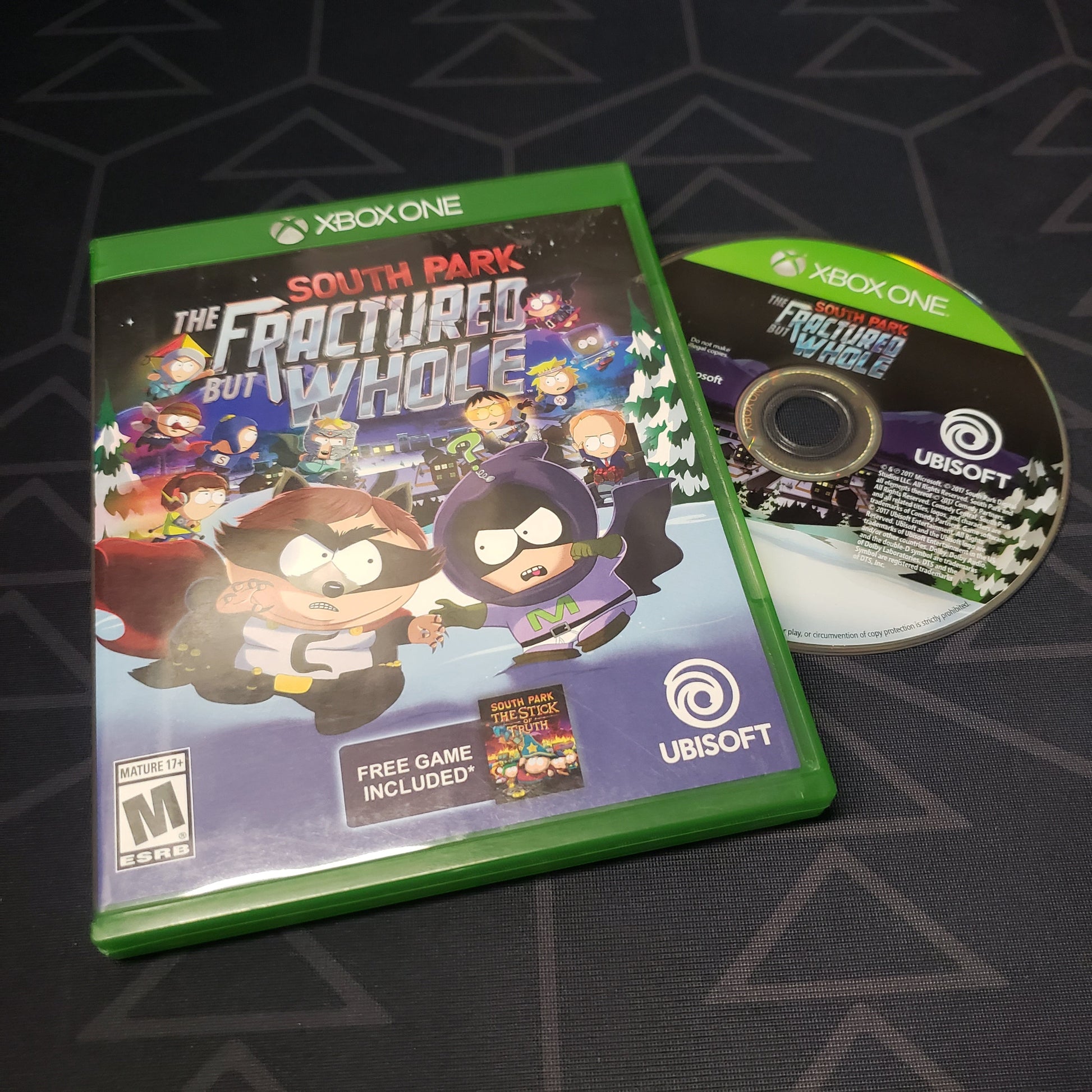 Image shows the case and disc for the video game South Park: The Fractured but Whole for Xbox One