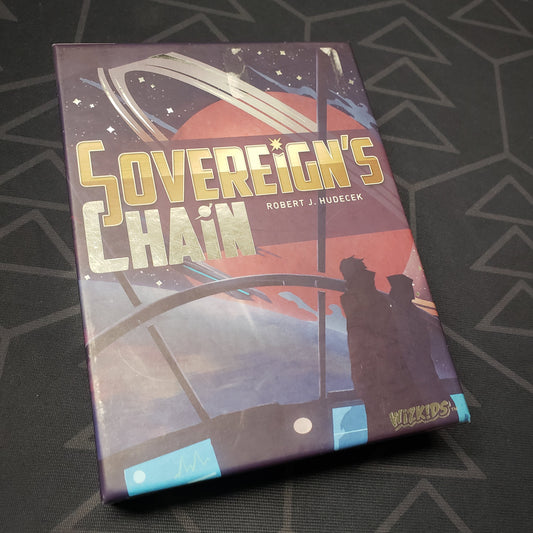 Image shows the front cover of the box of the Sovereign's Chain card game