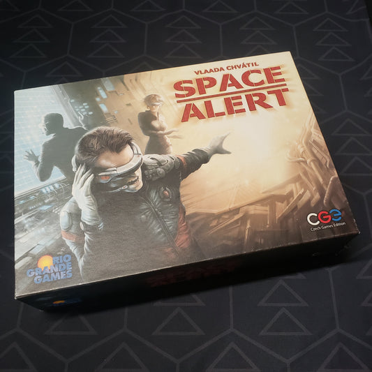 Image shows the front cover of the box of the Space Alert board game