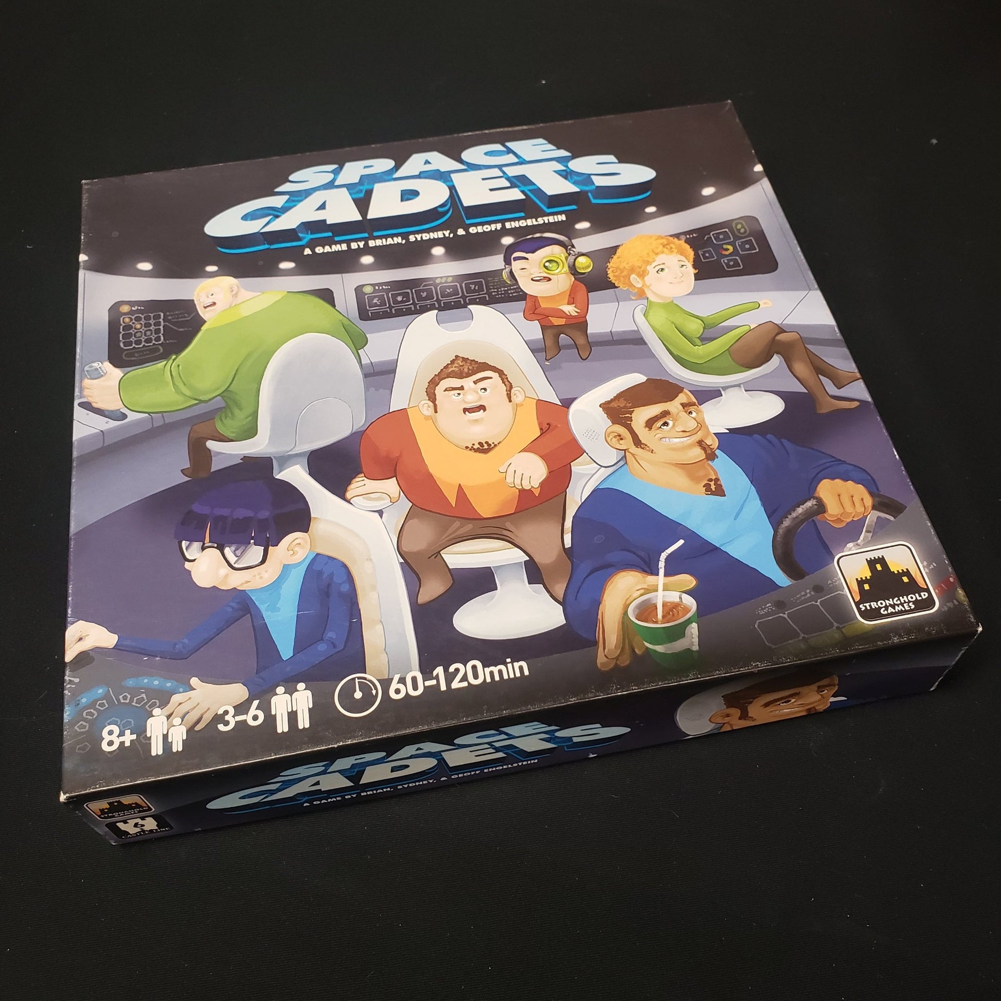 Image shows the front cover of the box of the Space Cadets board game