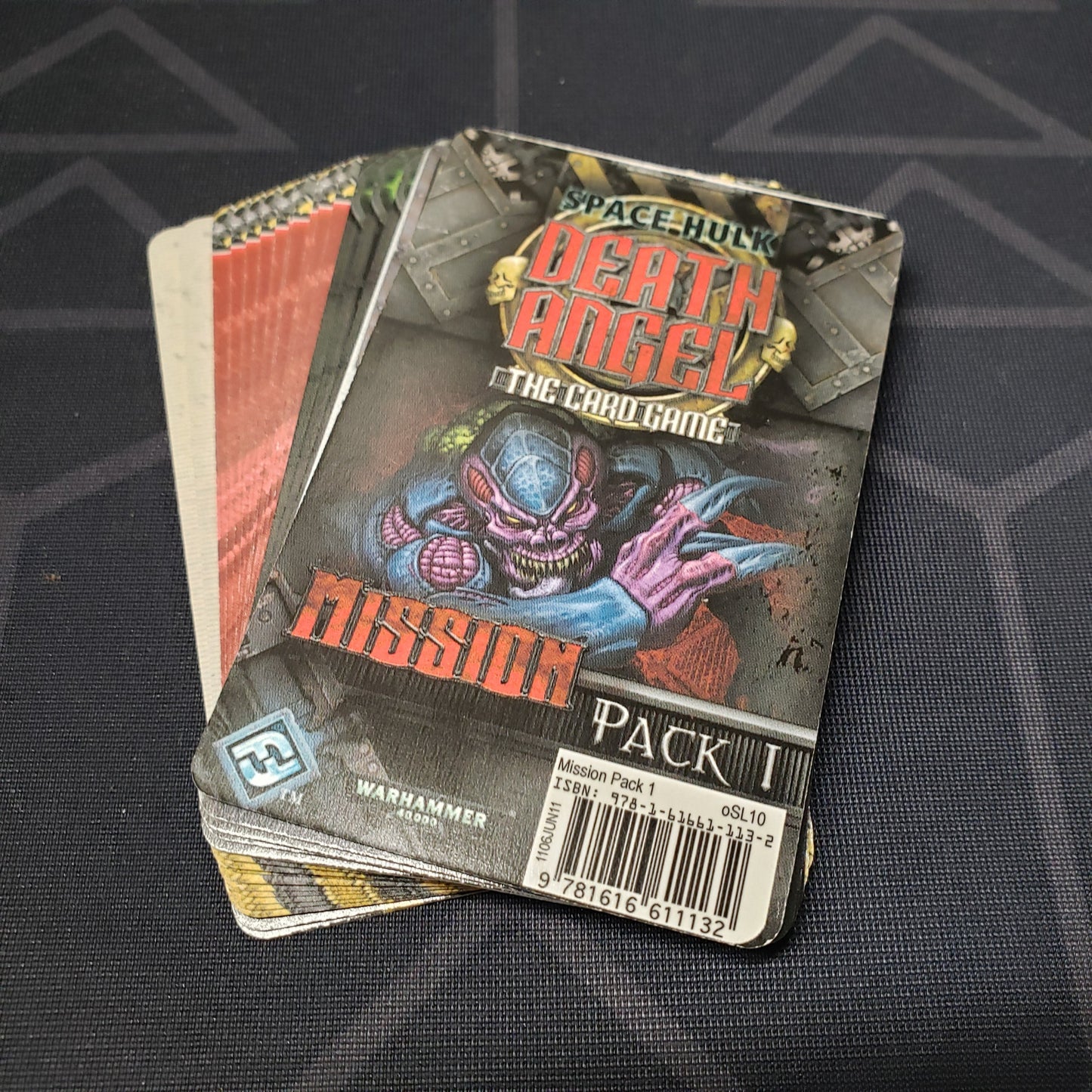 Image shows the fanned out cards for the Mission Pack 1 expansion for the card game Space Hulk Death Angel