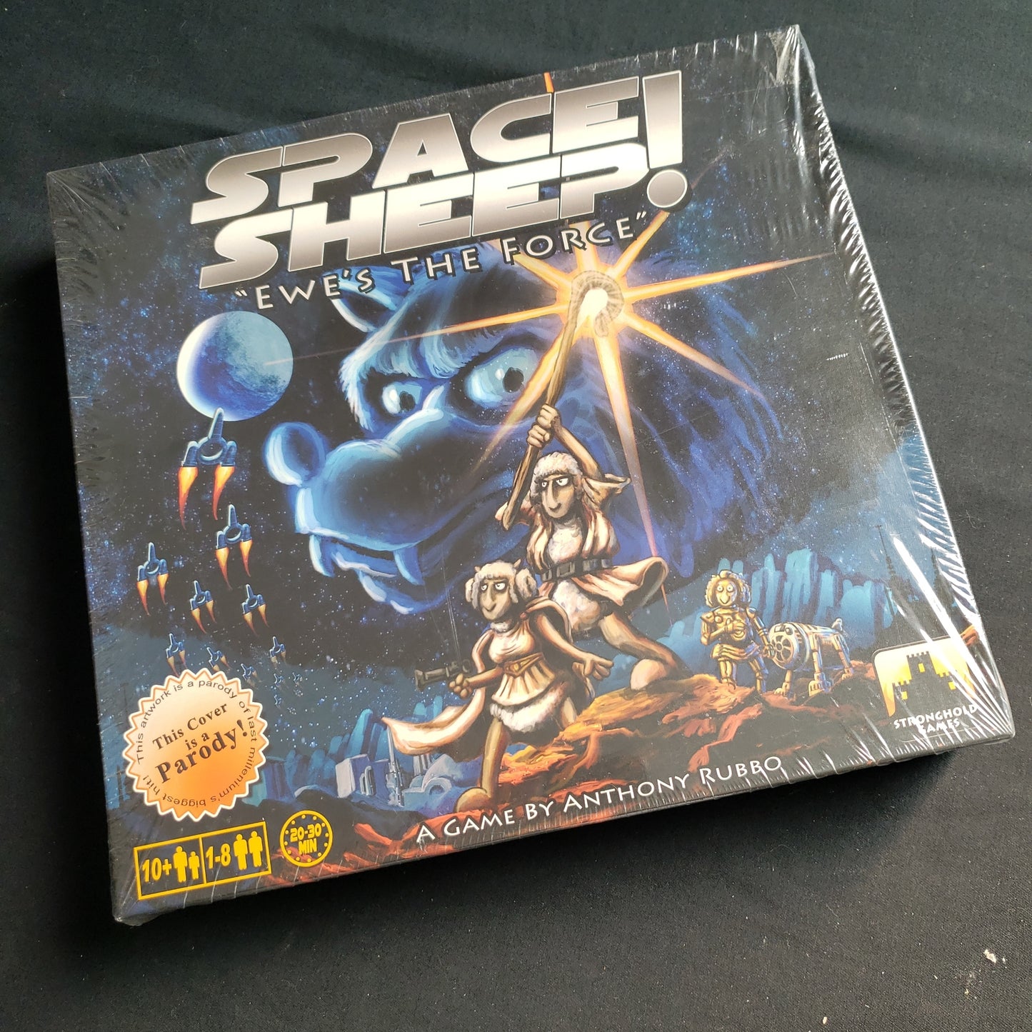 Image shows the front cover of the box of the Space Sheep board game