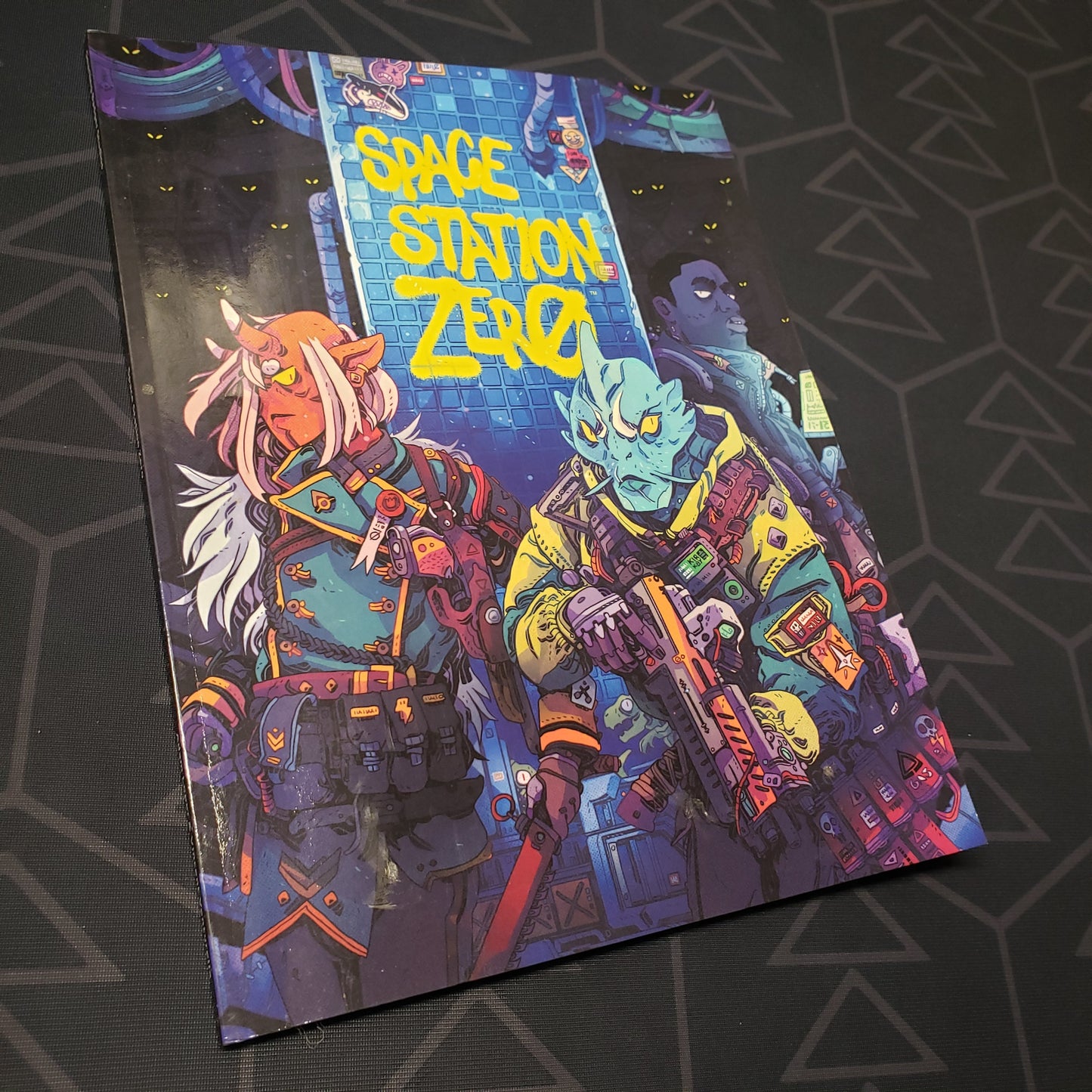 Image shows the front cover of the Space Station Zero wargaming book