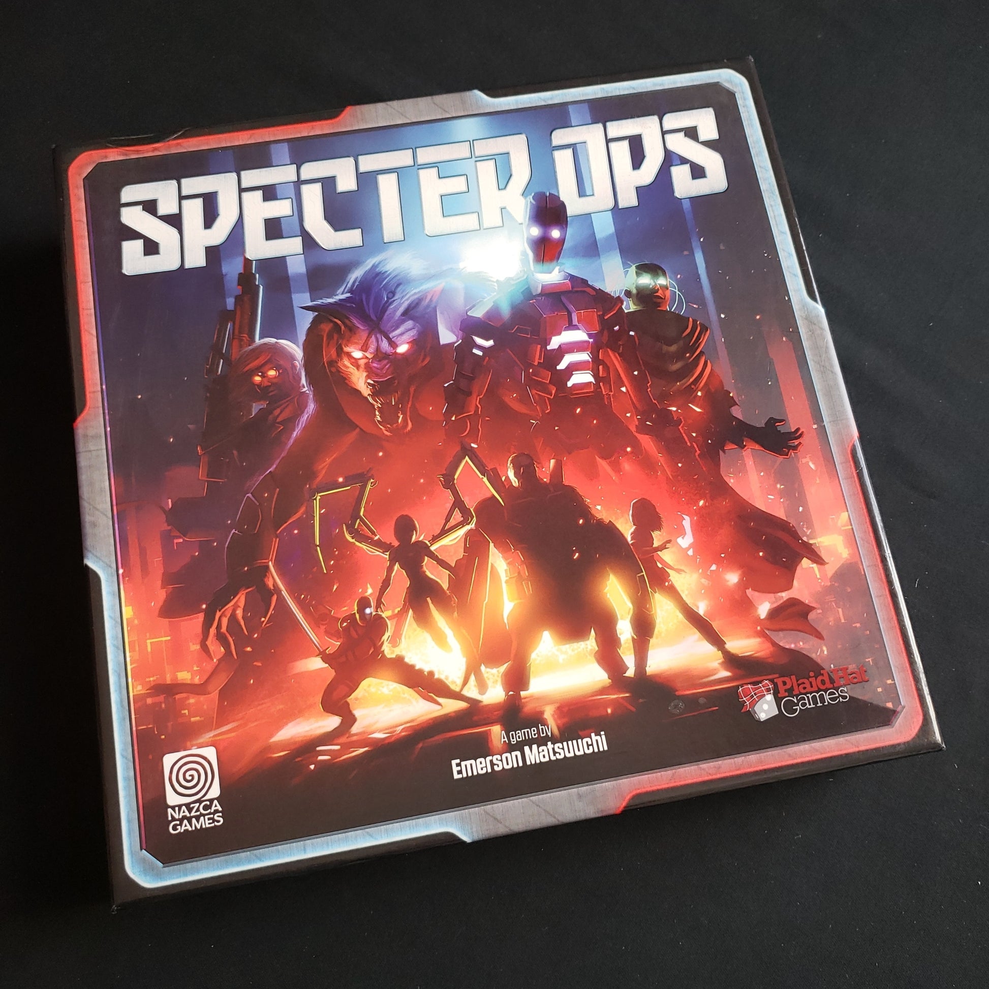 Image shows the front cover of the box of the Specter Ops board game