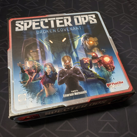 Image shows the front cover of the box for the Specter Ops: Broken Covenant board game