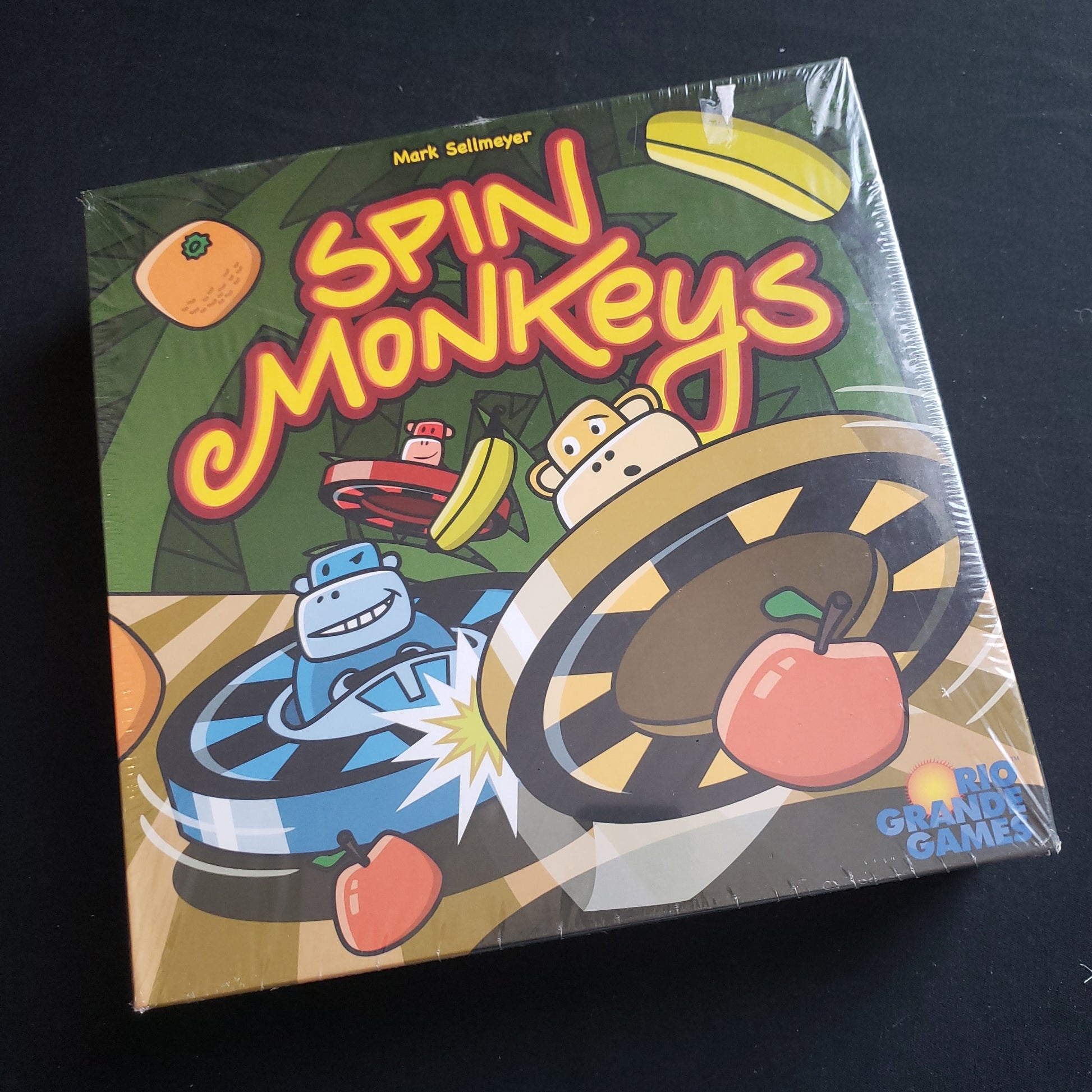Image shows the front cover of the box of the Spin Monkeys board game