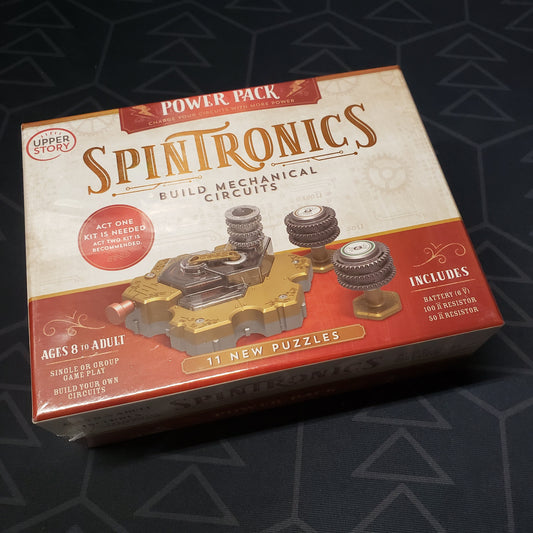 Image shows the front cover of the box of the Power Pack expansion set for the Spintronics STEM puzzle game