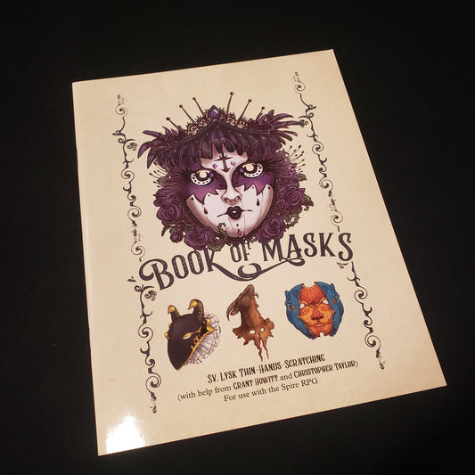 Image shows the front cover of the Book Of Masks for the roleplaying game Spire: The City Must Fall