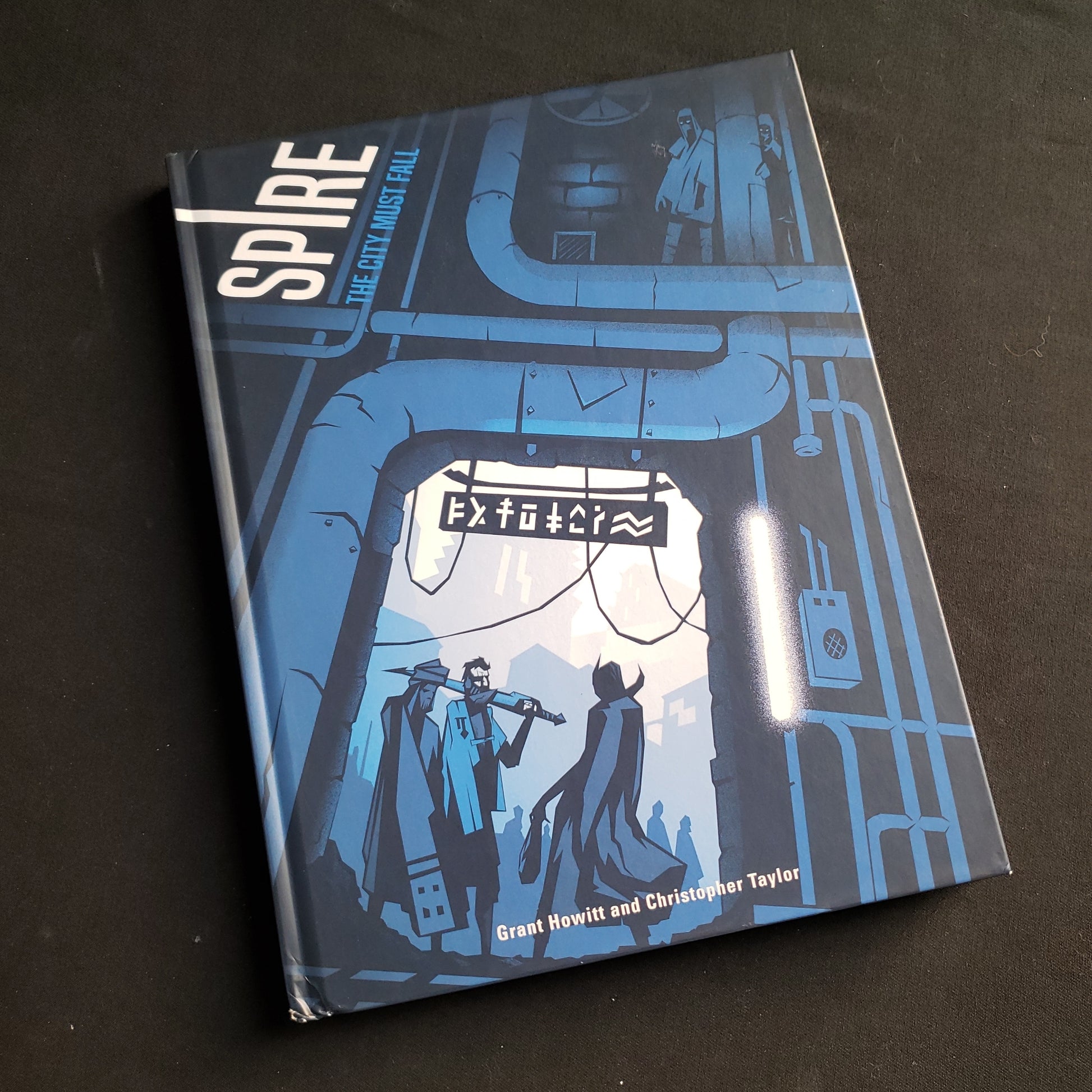 Image shows the front cover of the Spire: The City Must Fall roleplaying game book
