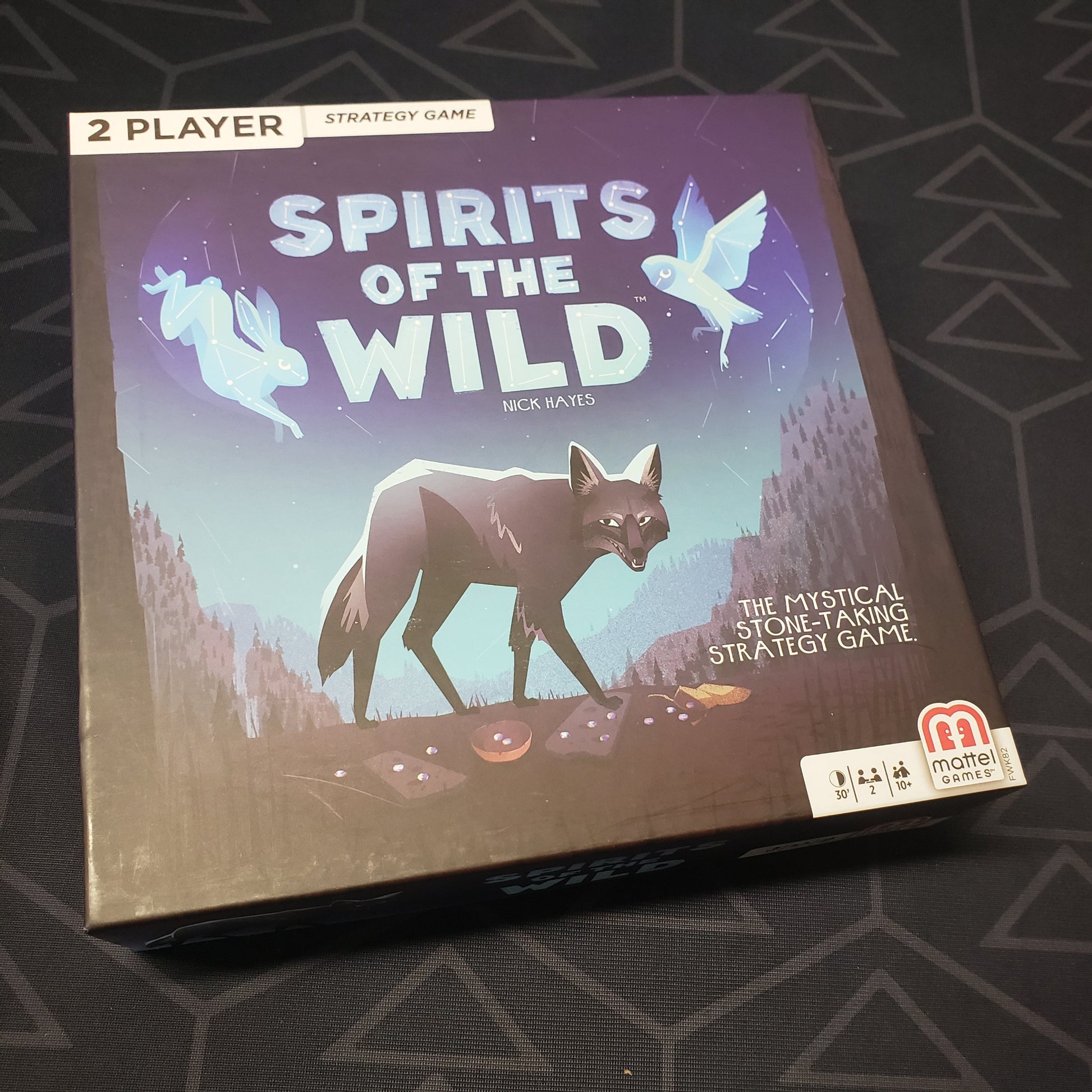 Image shows the front cover of the box for the Spirits of the Wild board game