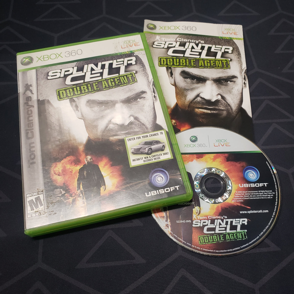 Image shows the case, manual and disc for the video game Splinter Cell: Double Agent for Xbox 360