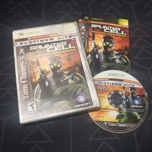 Image shows the case, manual and disc for the video game Splinter Cell: Pandora Tomorrow for the original Xbox