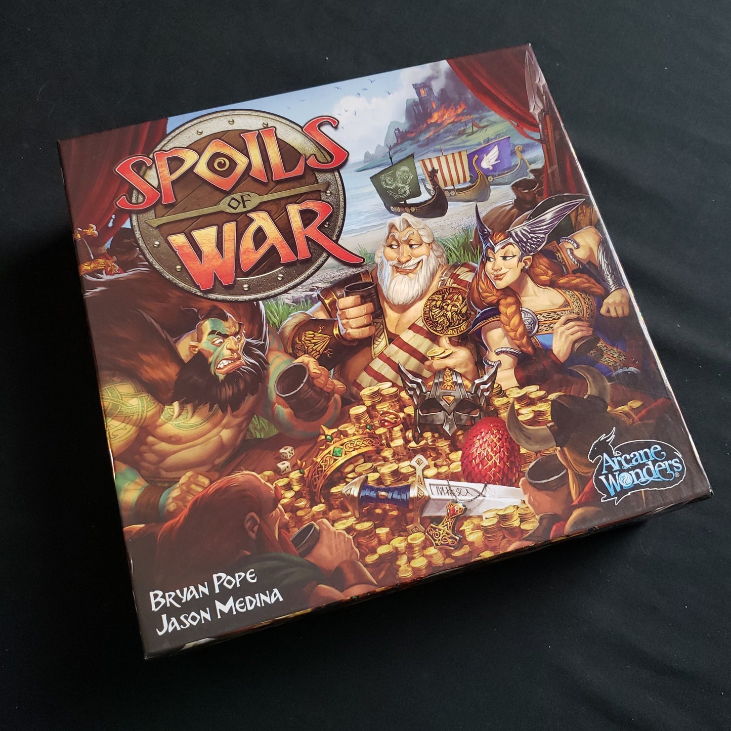 Image shows the front cover of the box of the Spoils Of War board game