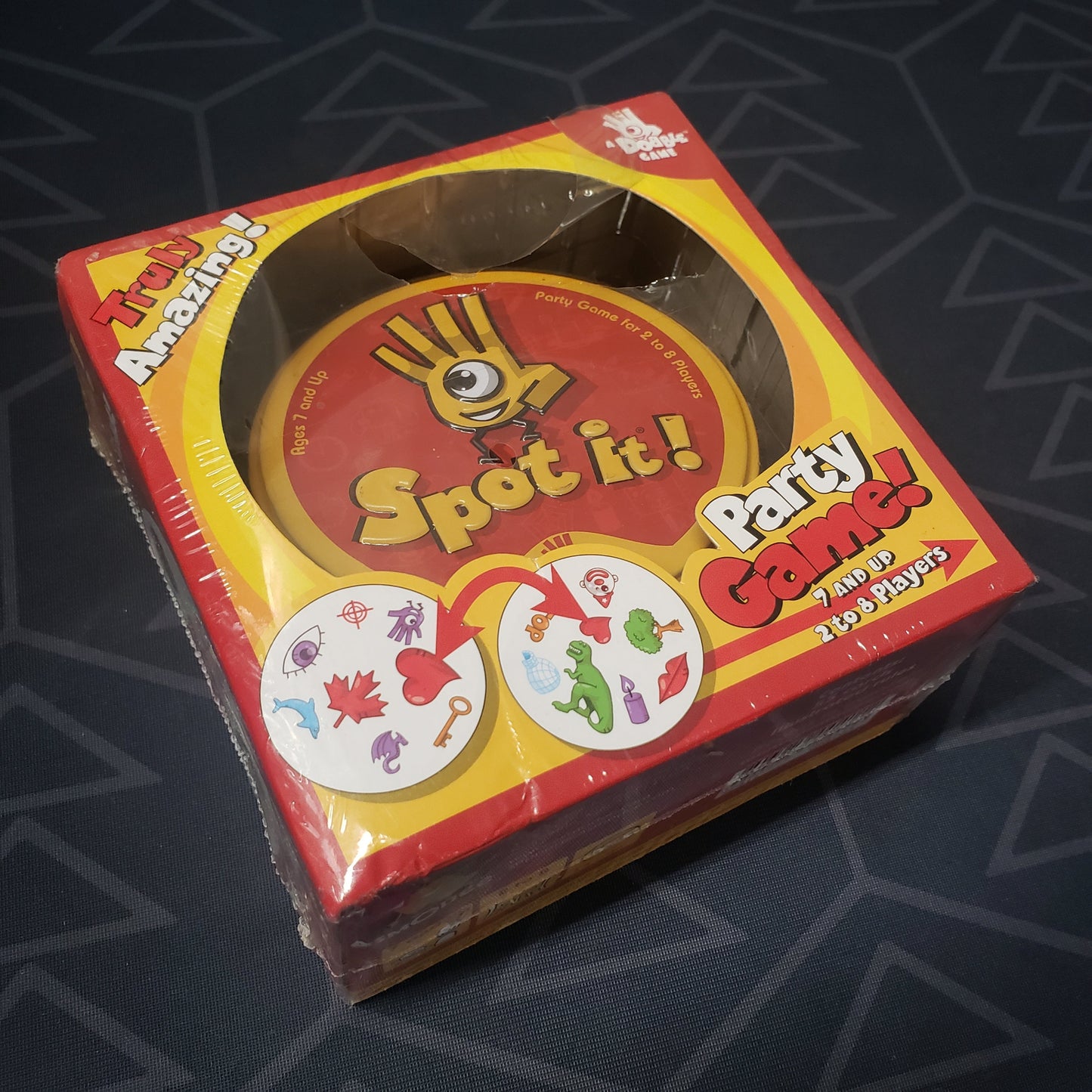 Image shows the front cover of the box for the Spot It! card game